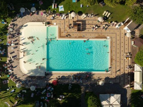 an overhead view of a swimming pool on top of a building at ISOLA VERDE Camping Village in Nettuno