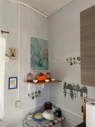 a kitchen with a stove and shelves in a room at Rifugio nel cuore dell'Abruzzo in Carpineto Sinello