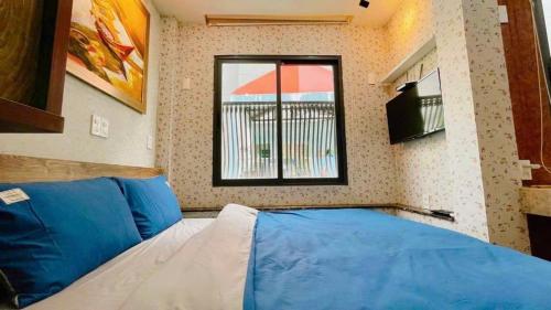 Katil atau katil-katil dalam bilik di Peanuts Home - Central HCM, 5 mins to Bui Vien l Full Amenities