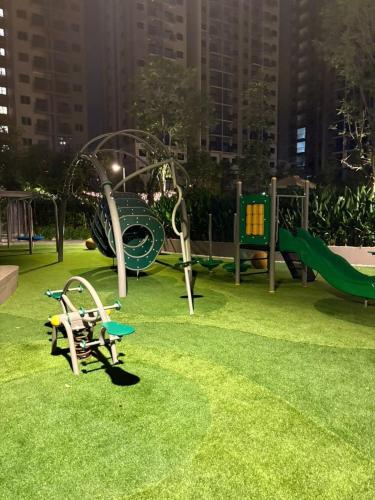 a park with a playground with a slide at Taman Equine comfy studio, high-end facilities in Seri Kembangan