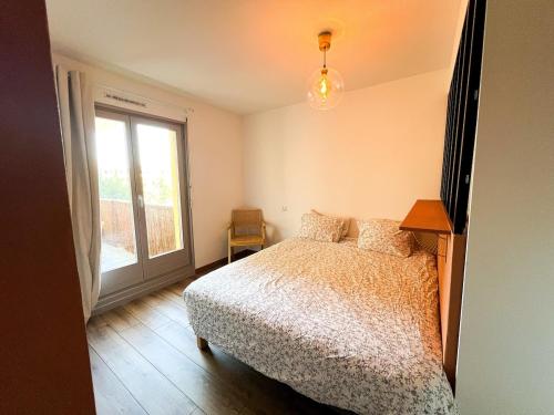 Postel nebo postele na pokoji v ubytování Le Cocon Saint Florent