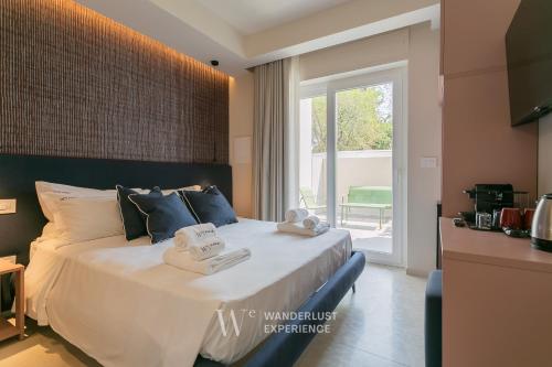 Postel nebo postele na pokoji v ubytování Wanderlust Experience Waves Lux Apartments