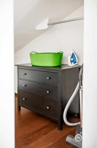 a green bowl on top of a dresser at My Wonderland in Salzburg