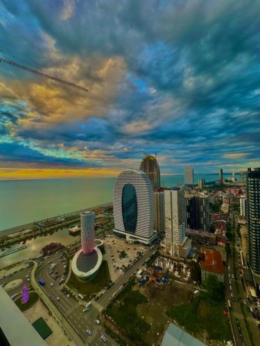 an aerial view of a city with the ocean at Orbi CIty Waterfront Aparthotel in Batumi