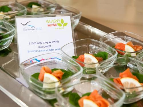a group of plastic containers filled with fruit and vegetables at Hotel Nadmorski in Gdynia