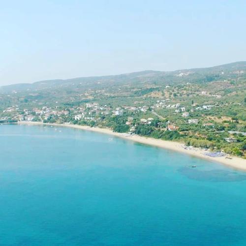 an aerial view of a beach with buildings and houses at ThalaSEA Apartments in Chrani