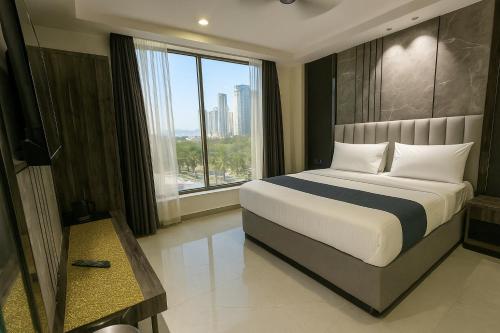 a bedroom with a large bed and a large window at Hotel Mountain Bliss' New Delhi City center in New Delhi