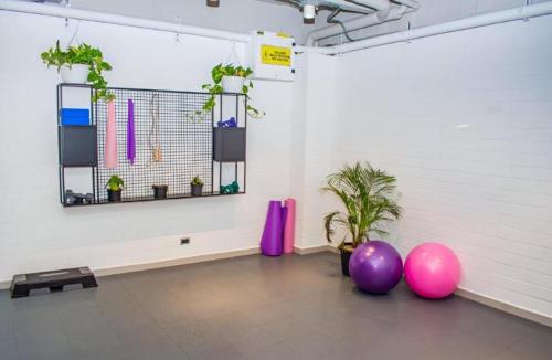 a room with purple and pink balloons and plants at BOHÍO del Pescador Barquero - Diverso y con Alma in Medellín