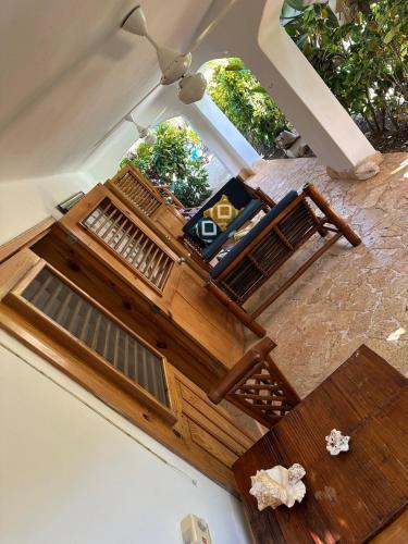 an overhead view of a room with a bed and a table at Las Palmeras apartment with pool Las Galeras in Las Galeras