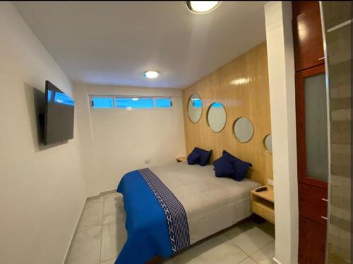 Ένα ή περισσότερα κρεβάτια σε δωμάτιο στο Edificio Confort