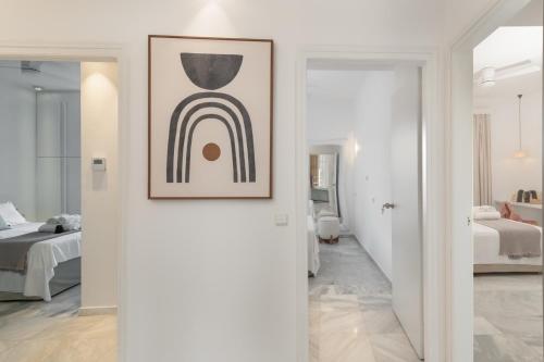a white room with a picture of a rainbow at Saitis Luxury Residence - 15 min from Matala - Kommos - Kalamaki Beach in Tympáki