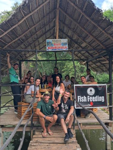 a group of people posing for a picture on a raft at Sam's Stay Buduruwagala in Wellawaya