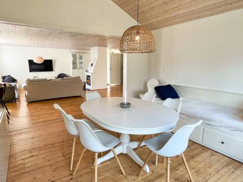 a white table and chairs in a living room at 4 star holiday home in Mönsterås-By Traum in Mönsterås