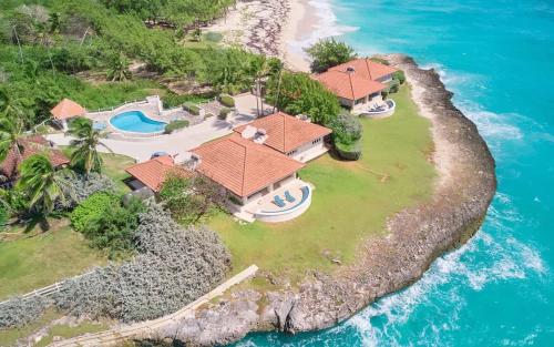 an overhead view of a house on a island in the ocean at ZenBreak Maltese Falcon 4bd in Saint Philip