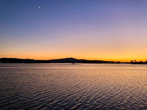 a sunset over a large body of water at Yoga Castia Complimentary Canoeing in Hot Springs