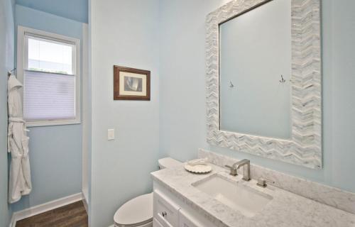 a white bathroom with a sink and a mirror at Yoga Castia Complimentary Canoeing in Hot Springs