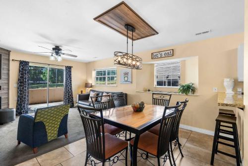 a dining room and living room with a table and chairs at Fairway View Escape - For 8 in Branson
