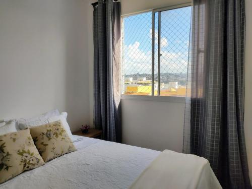 Postel nebo postele na pokoji v ubytování O Ninho do Galo