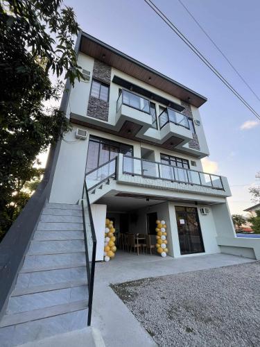 a building with a staircase in front of it at Lisro Sleep and Relax in San Juan