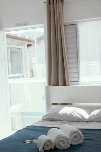 Ένα ή περισσότερα κρεβάτια σε δωμάτιο στο Casa DaLua Suítes