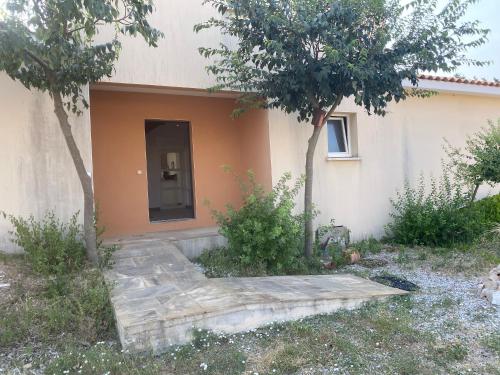 a house with a staircase in front of it at La Pampa au Mas des Issarts in Saint-Jean-de-Fos
