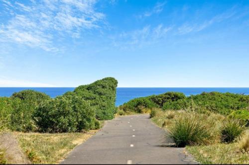 a road leading to the ocean on a beach at Seascape on the Dunes in Sellicks Beach