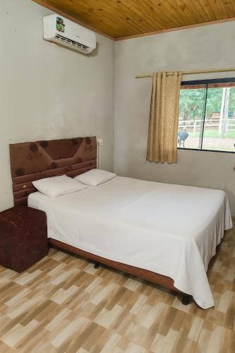 two beds sitting in a room with a window at Casa en Trinidad - Disponible para WRC in Trinidad