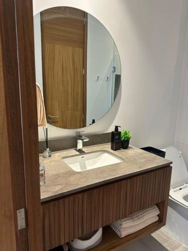 a bathroom with a sink and a mirror at Arama Bay Relaxation, Luxury and Elegance by the Sea in Bucerías