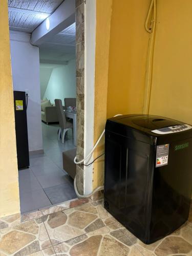 a trash can sitting in the corner of a room at Amplia y cómoda casa en Bello in Bello