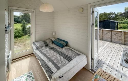 a room with a couch on a porch at 3 Bedroom Lovely Home In Gedser in Gedser