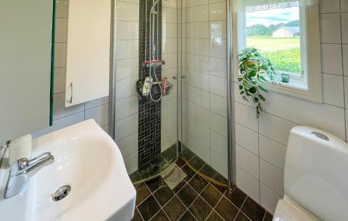 a bathroom with a sink and a shower at Nice Home In Vinberg With House A Panoramic View in Vinberg