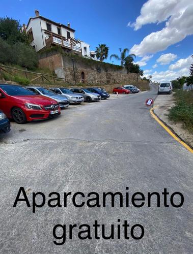 a bunch of cars parked in a parking lot at La casita de elle in Alora