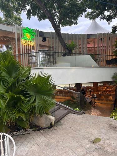 a view of a restaurant with tables and a fence at Tambuli Ocean Breeze in Maribago
