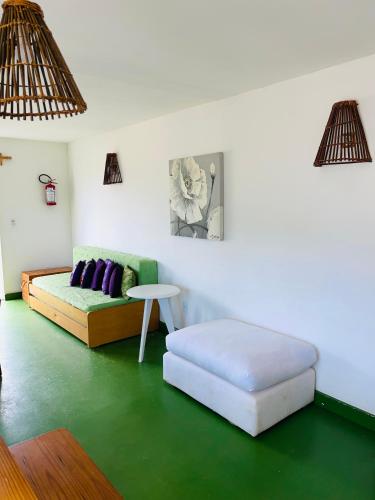 a living room with a couch and a table at Las Totoras PDD in Punta Del Diablo