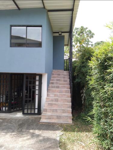a staircase leading up to a building with a door at Hotel Selva Cristal in San Carlos