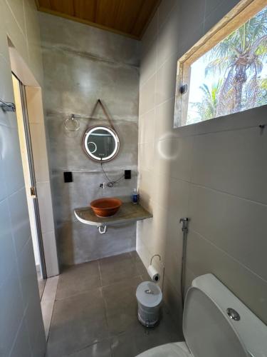 a bathroom with a sink and a toilet at Pousada Casa Ferreira in Pirenópolis