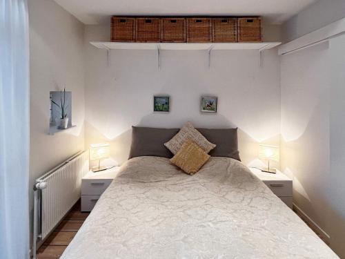 a bedroom with a large bed with two night stands at Central Oasis in Lokken - By Traum Ferienwohnungen in Løkken