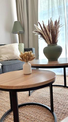 a living room with two tables with a vase on it at Duna & Mar I Concon in Concón