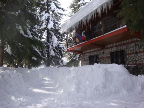 a pile of snow in front of a building at B&B Villa Tina in Alfedena