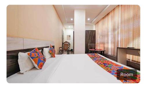 Ένα ή περισσότερα κρεβάτια σε δωμάτιο στο Hotel O Lavish Residency