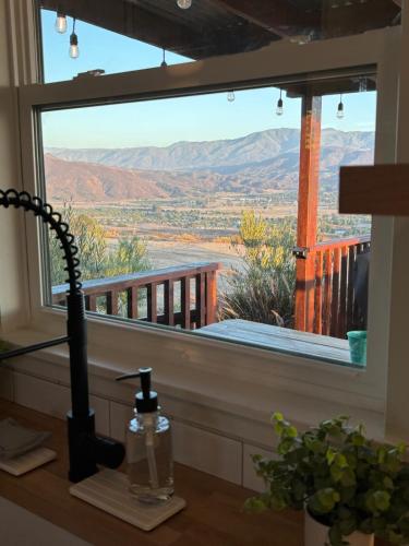 a window in a room with a view of the desert at The Hilltop Haven - Private View Suite in Temecula