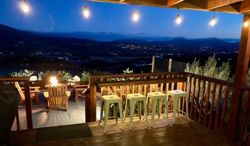 a deck with chairs and a table and a view at The Hilltop Haven - Private View Suite in Temecula