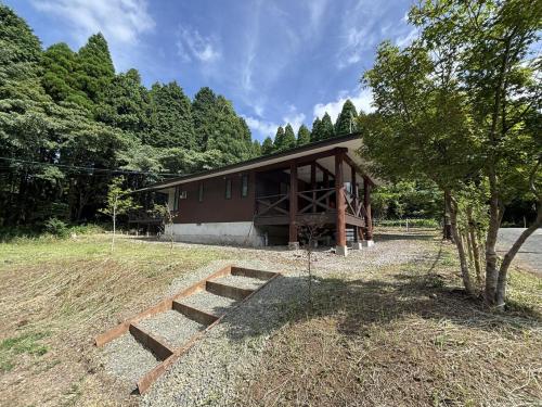 a building with stairs in front of it at ChillOut MINAMIASO チルアウト南阿蘇 in Minami Aso