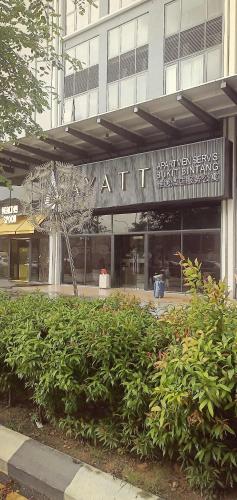 a building with a sign on the front of it at Agile TRX Luxury Condo in Bukit Bintang in Kuala Lumpur