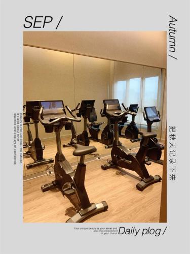 a room with a row of desks with computers at Agile TRX Luxury Condo in Bukit Bintang in Kuala Lumpur