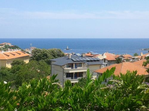 a view of the ocean from a city at The Colourful Mansion Hotel in Ahtopol