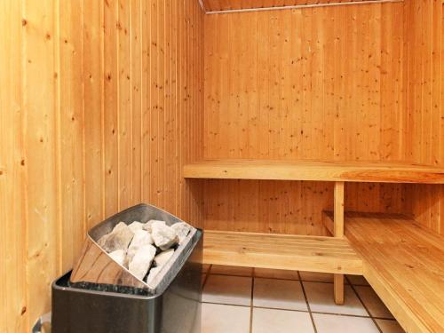 a sauna with a trash can in the middle at 4 star holiday home in Væggerløse in Bøtø By