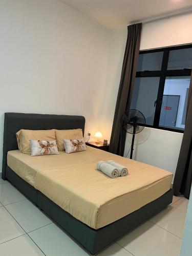 a bedroom with a large bed with two pillows at Latte Homestay Desaru 5GWifi with Swimming Pool in Bandar Penawar
