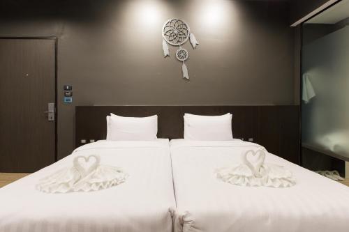 Postel nebo postele na pokoji v ubytování Maya Phuket Airport Hotel-Naiyang Beach
