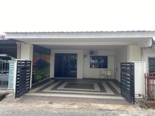 Facaden eller indgangen til Casa Cinta Homestay Pendang